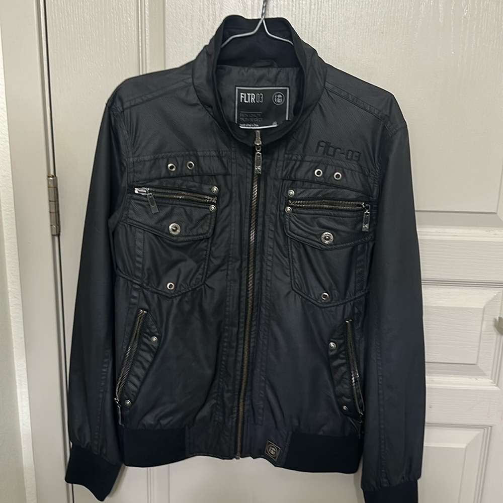Nice dark gray jacket with squared lines and lots of zippers